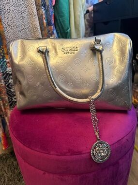 GUESS Metallic Silver Embossed Satchel with Chain Charm
